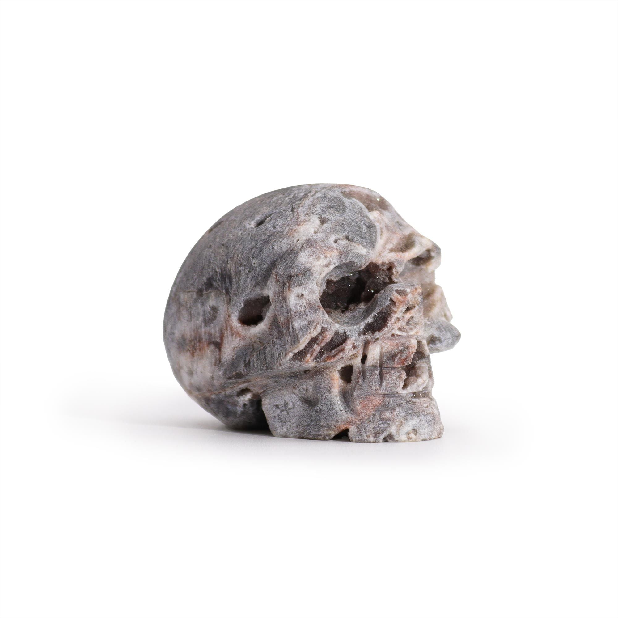 Caveira Esculpida em Geodo de Calcite (aprox. 4,5cm)